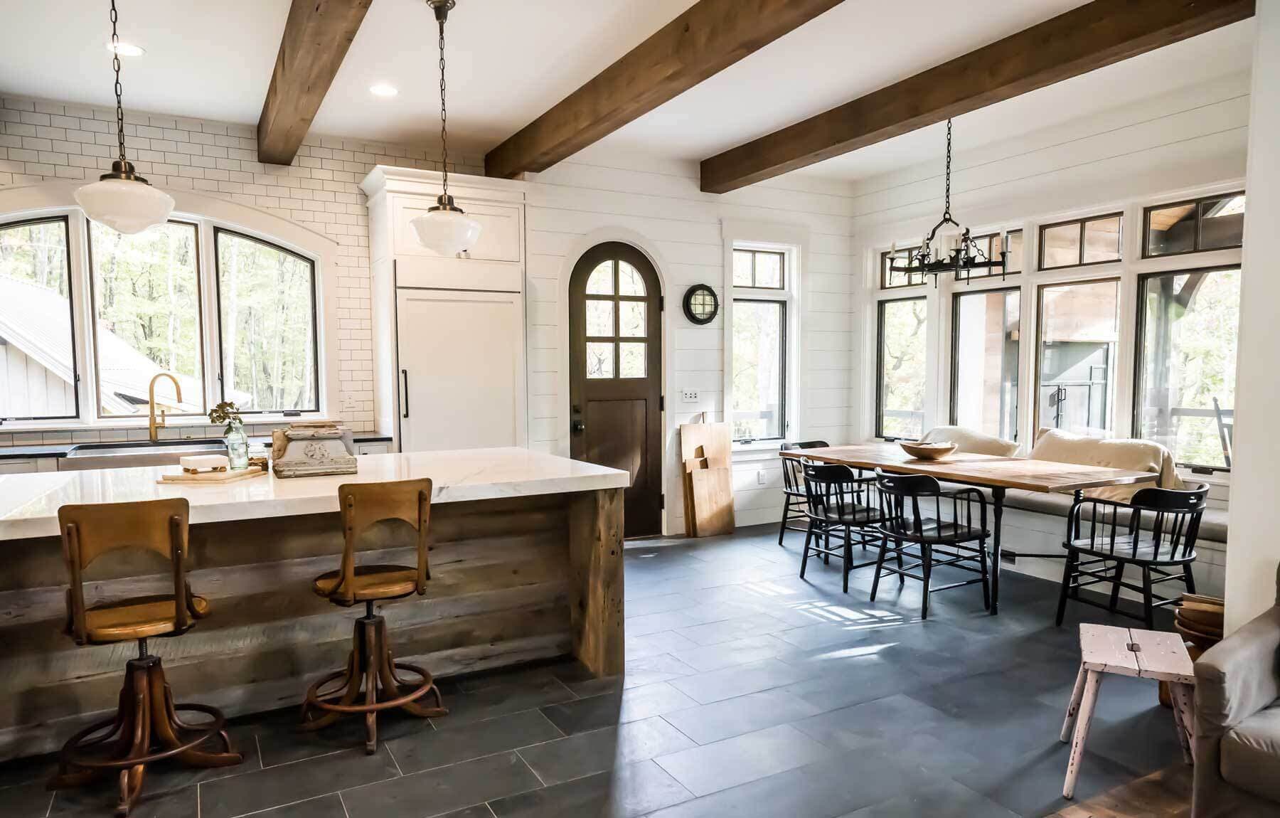 Rustic circular sawn reclaimed wood box beams installed in kitchen and dining ceilings.