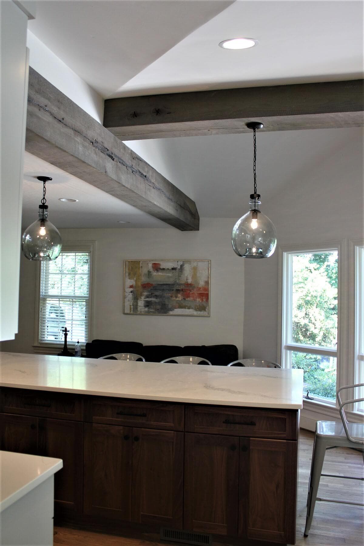 two Circle sawn box beams at angles in a kitchen