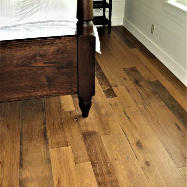 Smooth reclaimed White Oak flooring in bedroom.