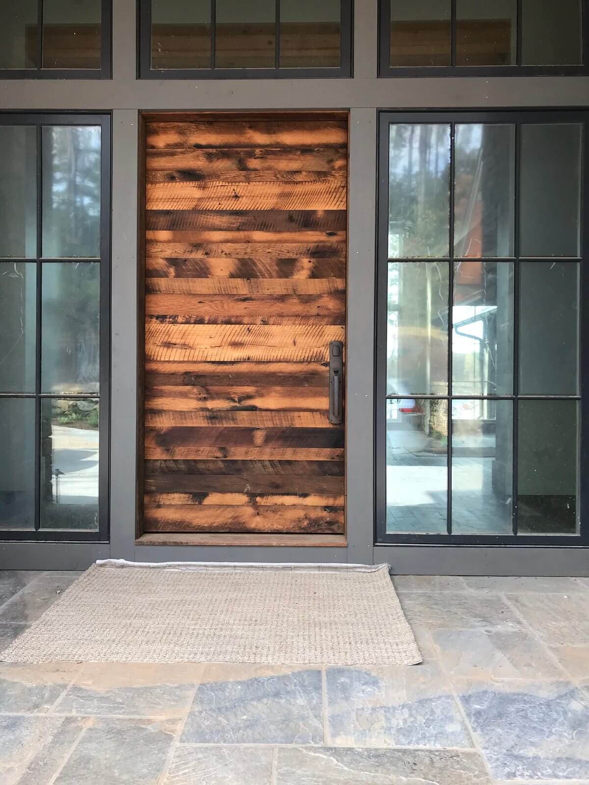 Stunning modern reclaimed wood front door engineered to perfection.