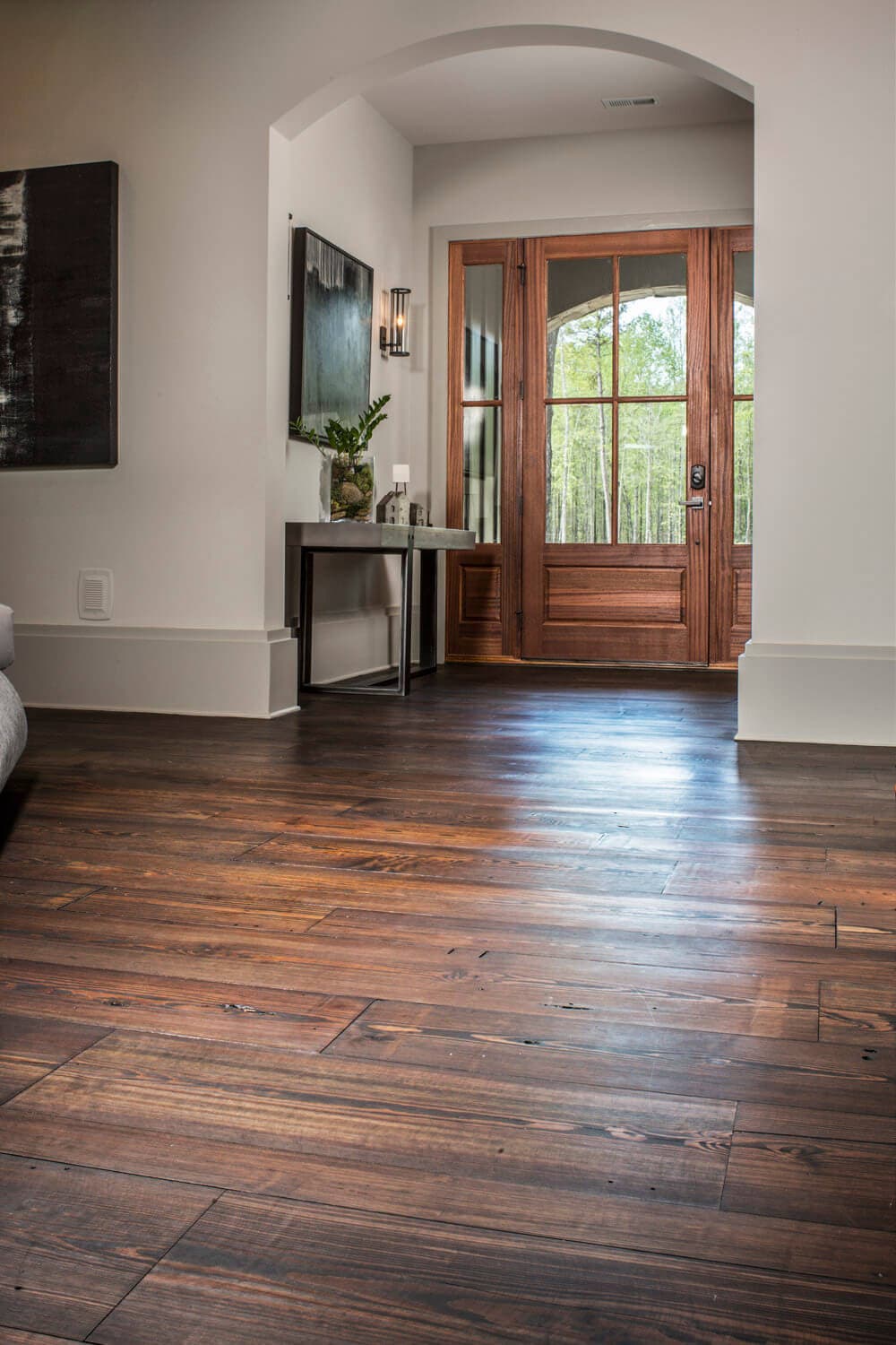 plain sawn heart pine floor with a view to the front door
