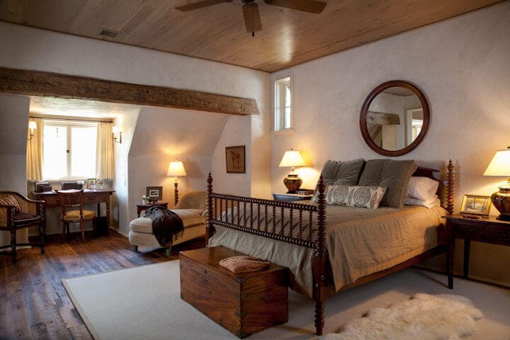 Hand hewn accent beams in a bedroom