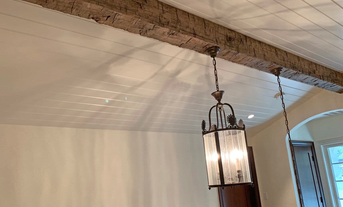 Hand hewn box beam with hanging fixture and hidden cords
