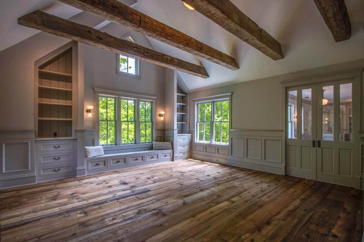 Hand hewn decorative wood ceiling beam wraps.