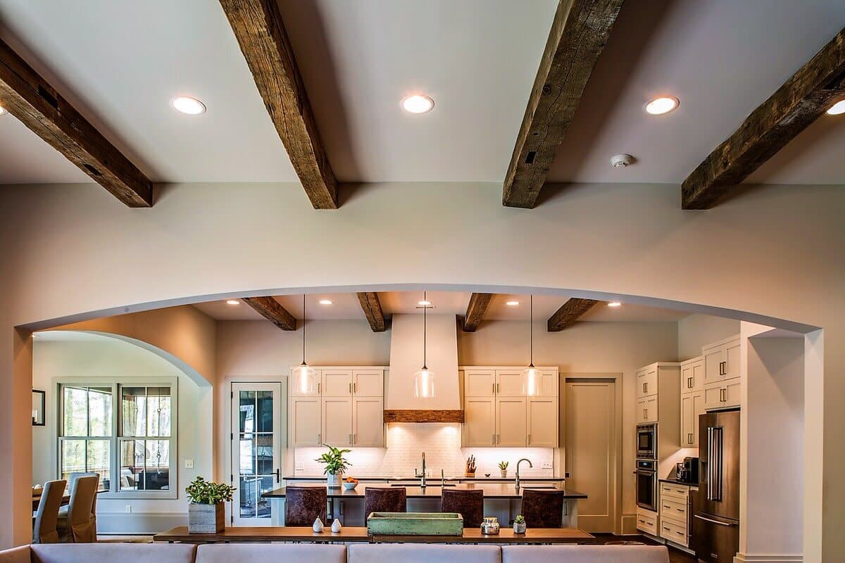 Hand hewn box beam ceiling beam style above kitchen.