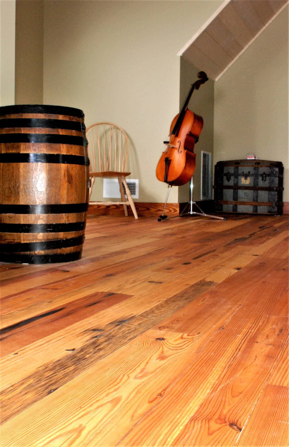 Heart pine flooring in a room with a cello hendersonville nc