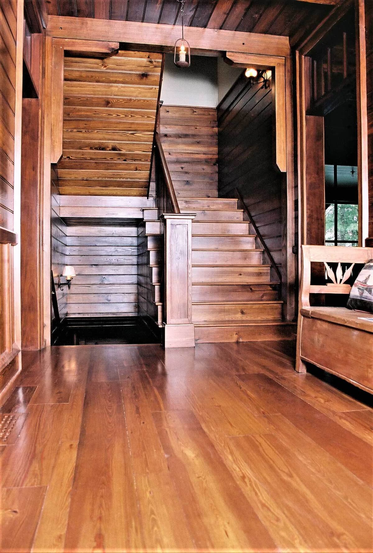 Reclaimed heart pine wood stair treads and landing in Lake Toxaway North Carolina.