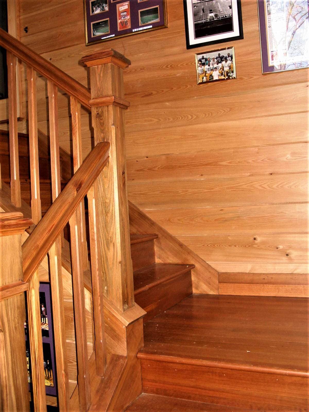 heart pine stairway landing, post and banister with heart pine  horizontal wall cladding