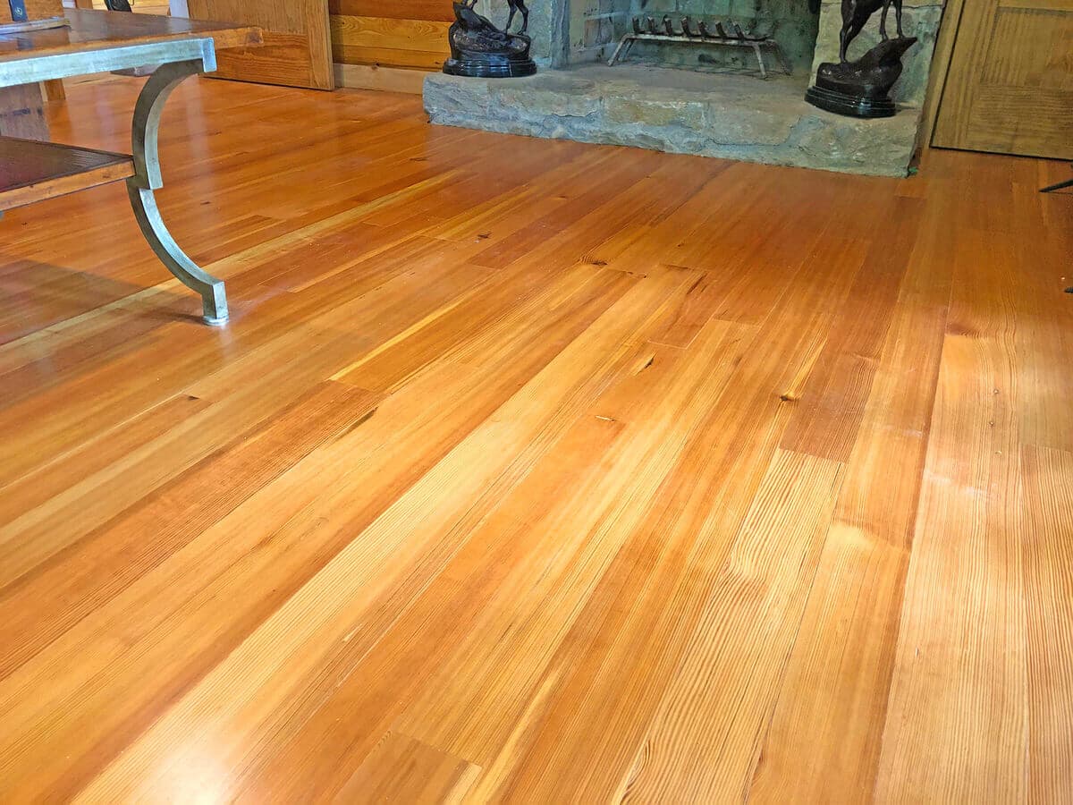 prime grade heart pine vertical grain floor angled left from a fireplace