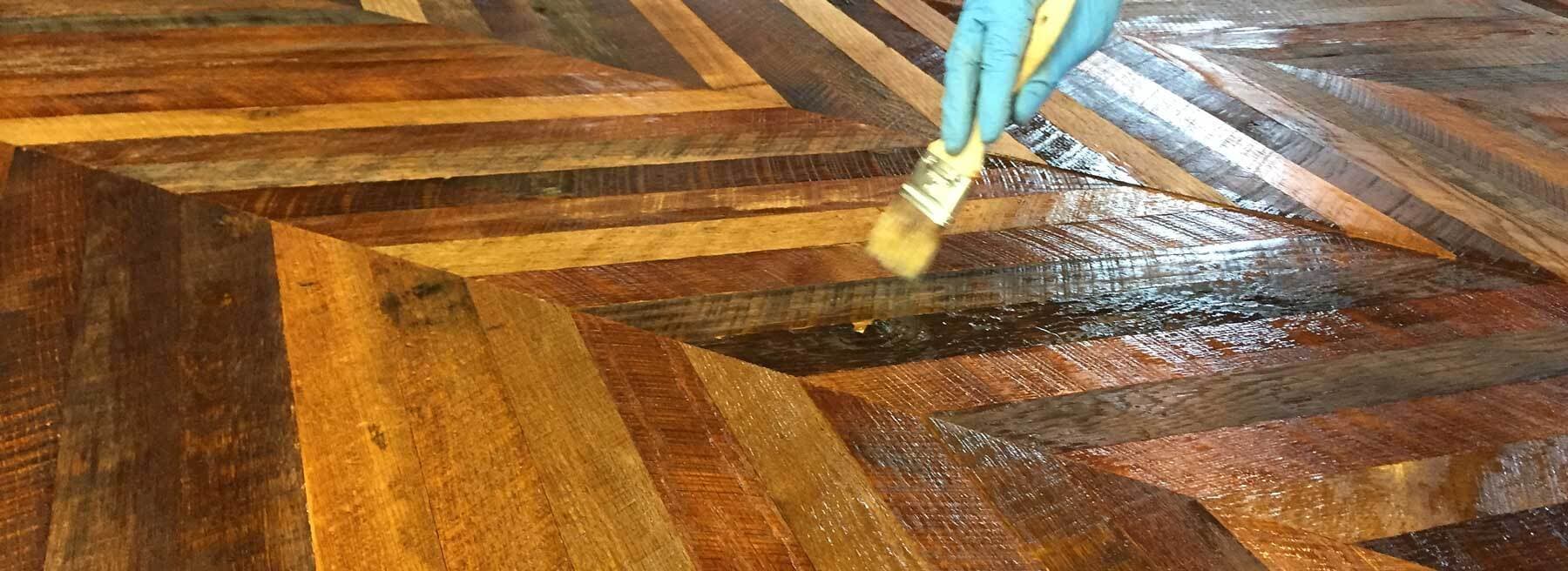Staining chevron reclaimed wood for accent wall.