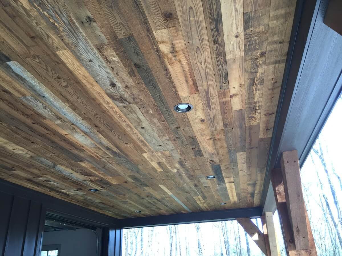 Rustic porch ceiling from reclaimed wood.