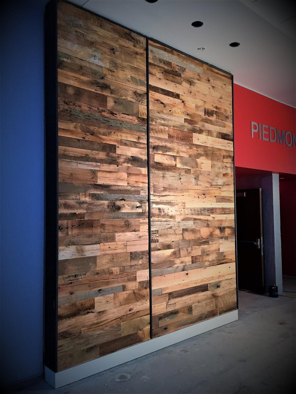 Reclaimed hardwood accent wall in commercial space.