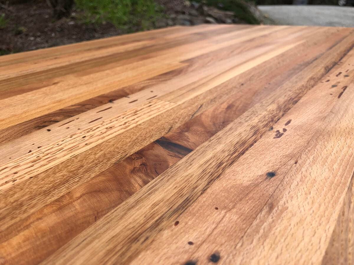 closeup of reclaimed mixed hardwood countertop ready to get installed.