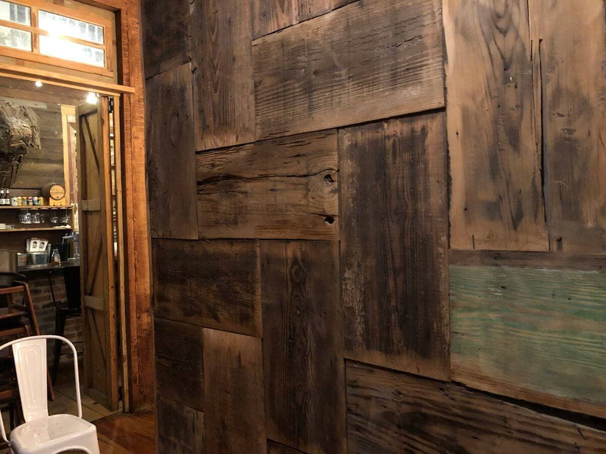 Reclaimed wood accent wall tiles in New Orleans restaurant restaurant