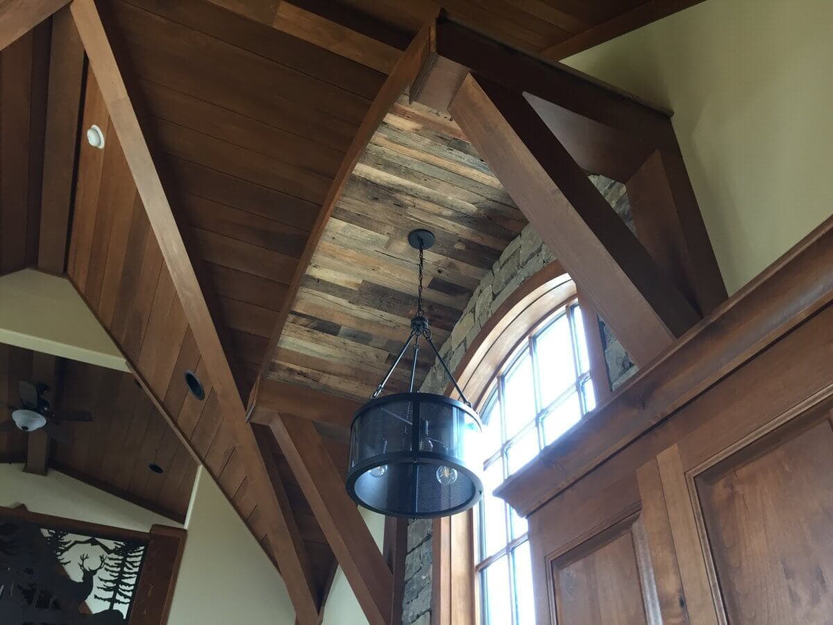 reclaimed hardwood entry accent ceiling and window at lake toxaway nc