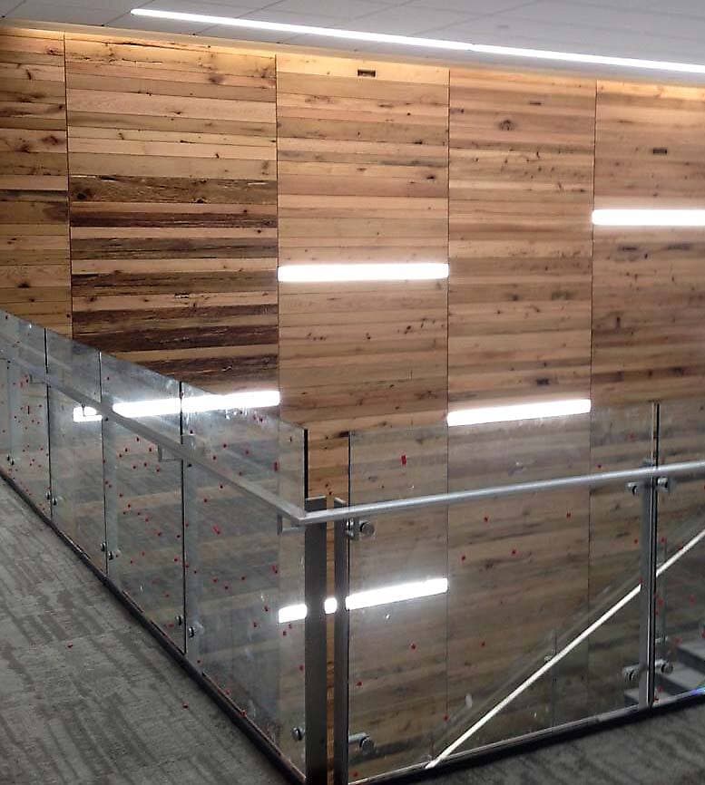 Reclaimed wood for oak accent wall in Durham North Carolina Bayer building.