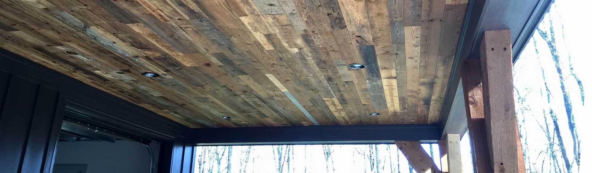 Reclaimed wood for rustic porch ceiling.