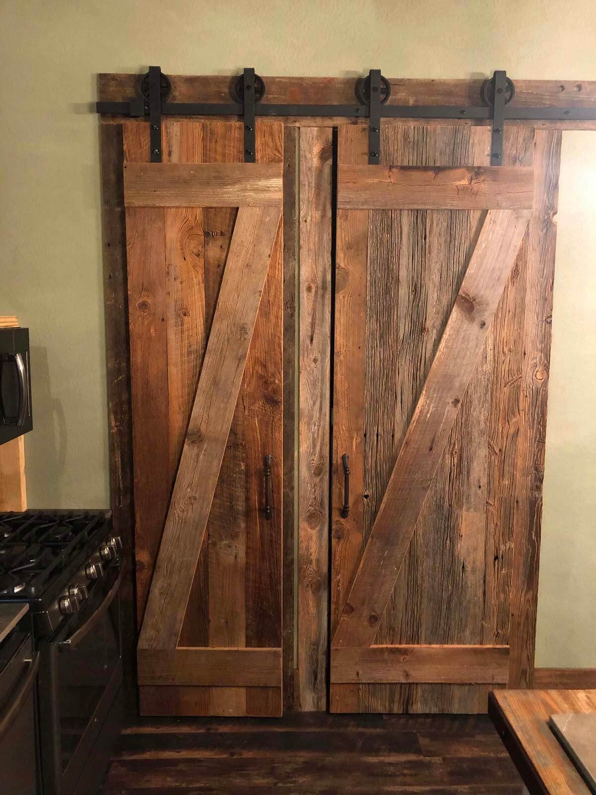 Rustic sliding barn door made from reclaimed wood.