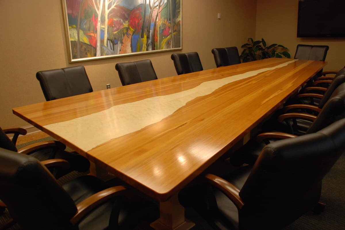 wood conference table seating 12 with irregular antique maple surrounded by heart pine and with a glossy finish