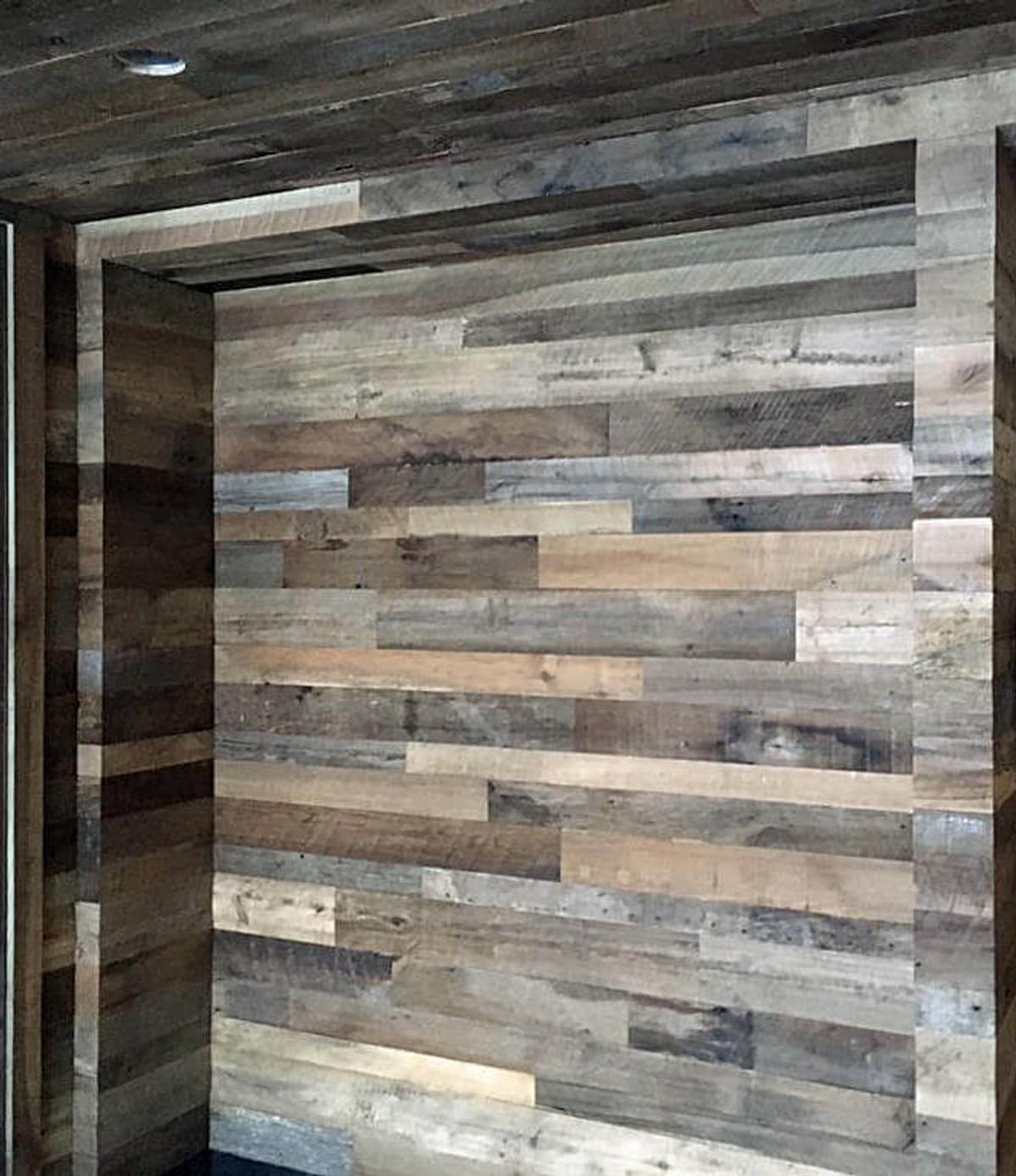 gray and brown reclaimed hardwood wall cladding in Fairview NC