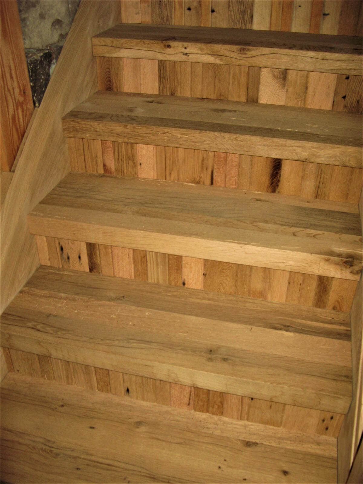 rustic hardwood stairs with narrow width vertical board risers