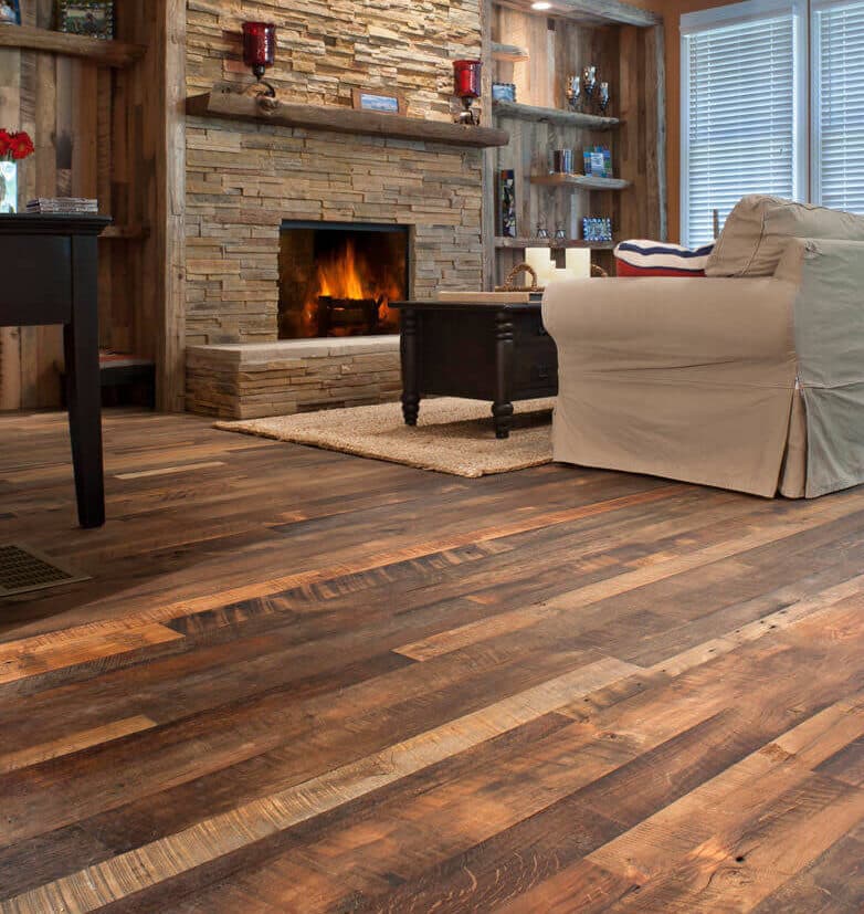 Rustic mixed hardwood flooring in living room with fireplace.