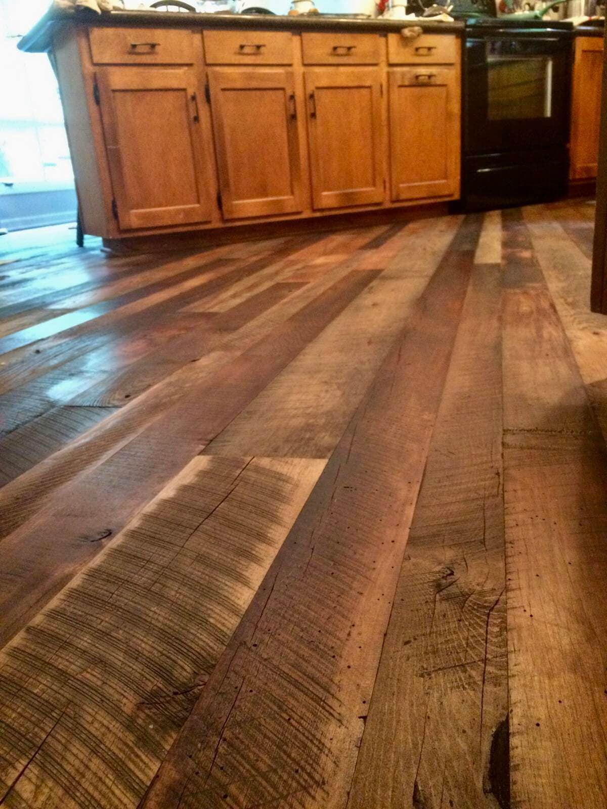 Reclaimed hardwood flooring in kitchen.