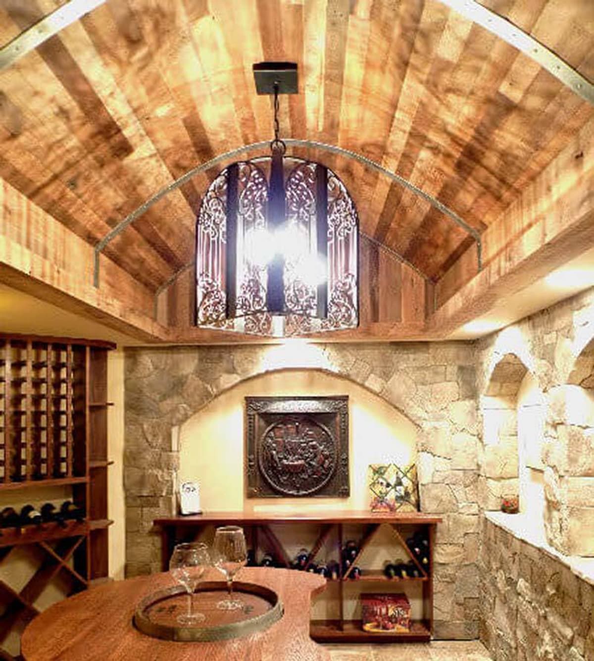 Rustic wood ceiling with reclaimed wood paneling in wine cellar.