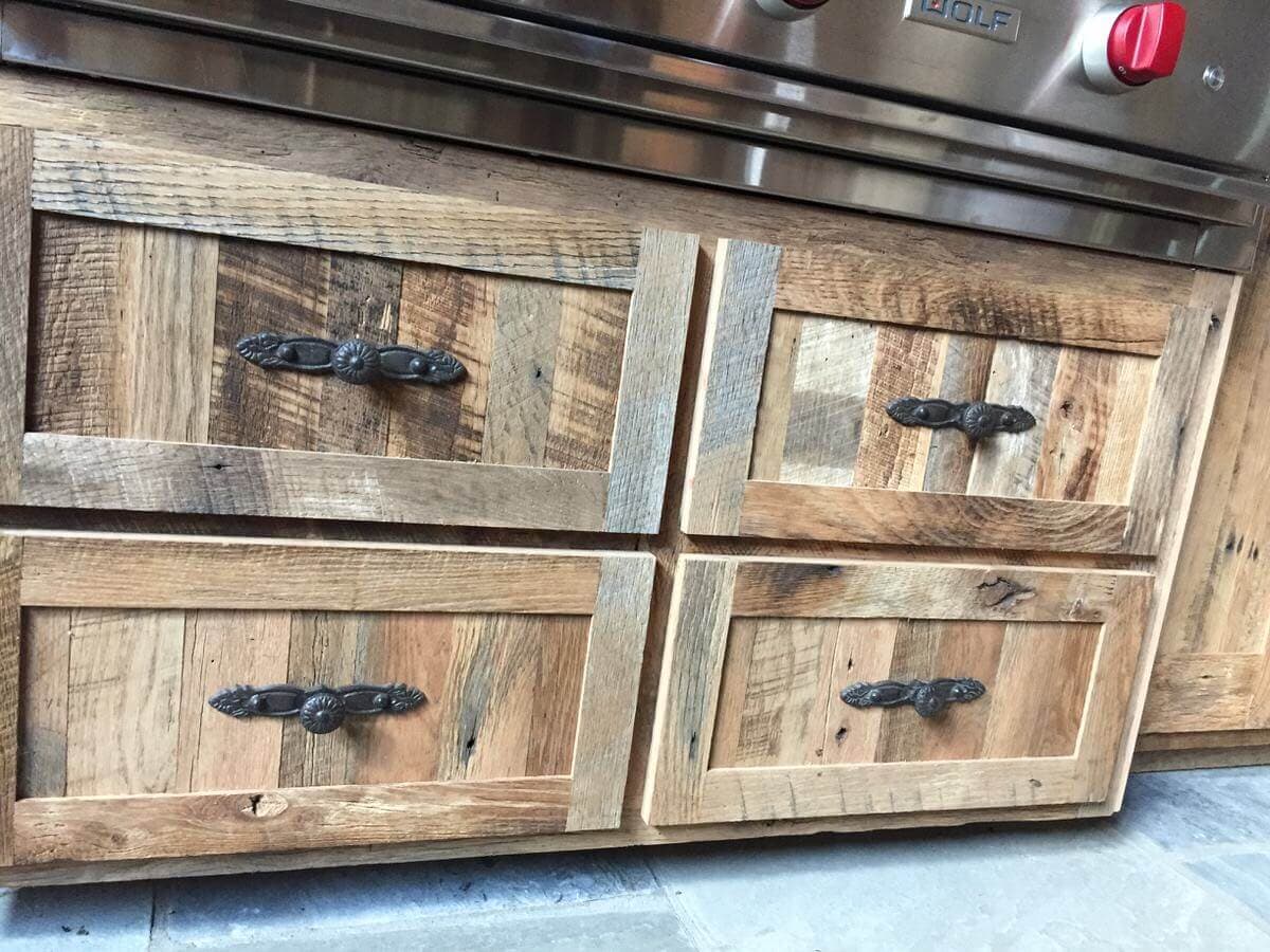 two sets of two rustic reclaimed stacked cabinets with black handles