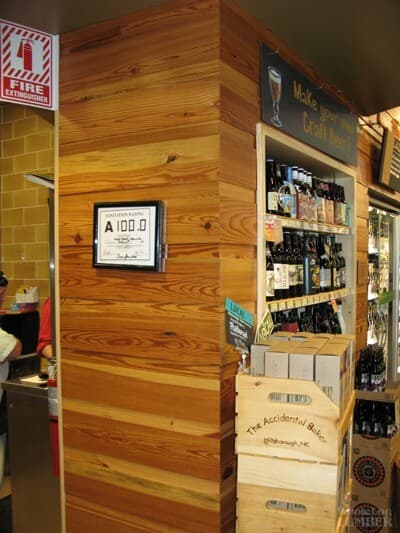 Reclaimed wood accent wall at Whole Foods in Raleigh for LEED certification.