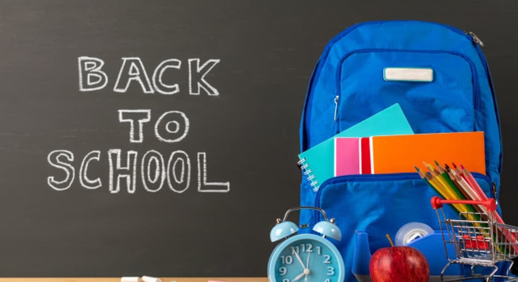 Education back school concept backpack stationery supplies classroom desk with chalkboard background 101840 229
