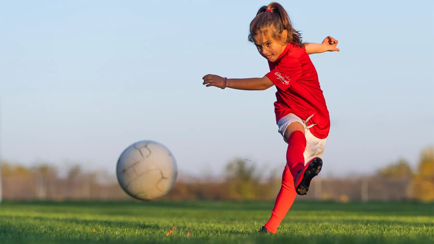 Skew for Uefa Euro 2020, girl kicking football, England
