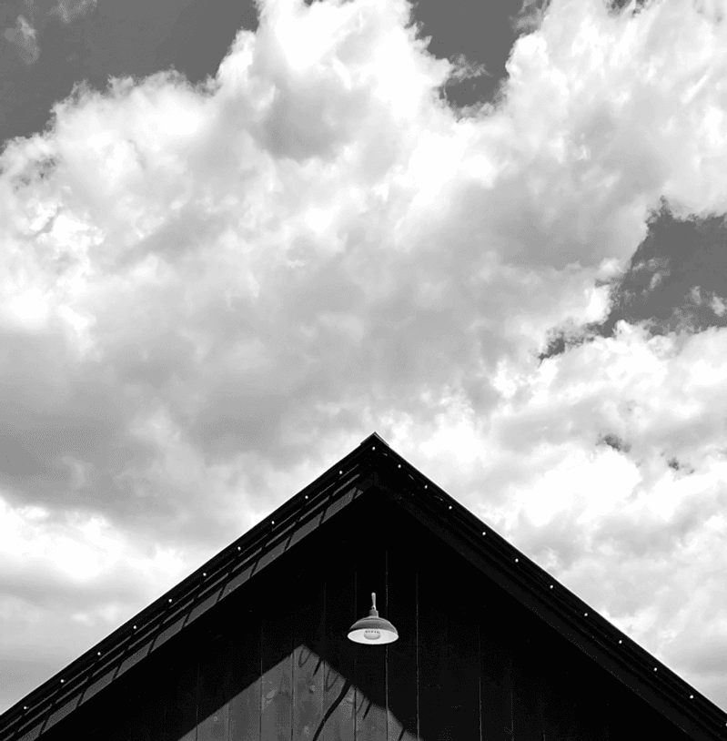The top of the post and beam Black Barn that serves as an entrance to Maine Beer Company's tasting room.