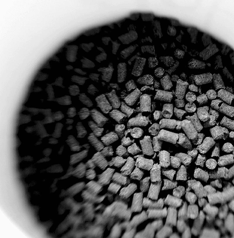 A black and white photo of hop pellets