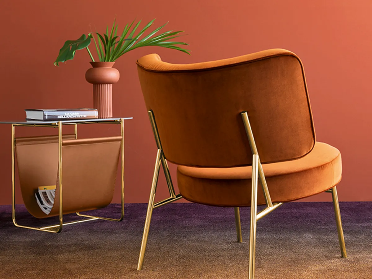 Coco Lounge Chair Bracing Back Exposed Metal Frame In Orange Furniture Trends For 2019