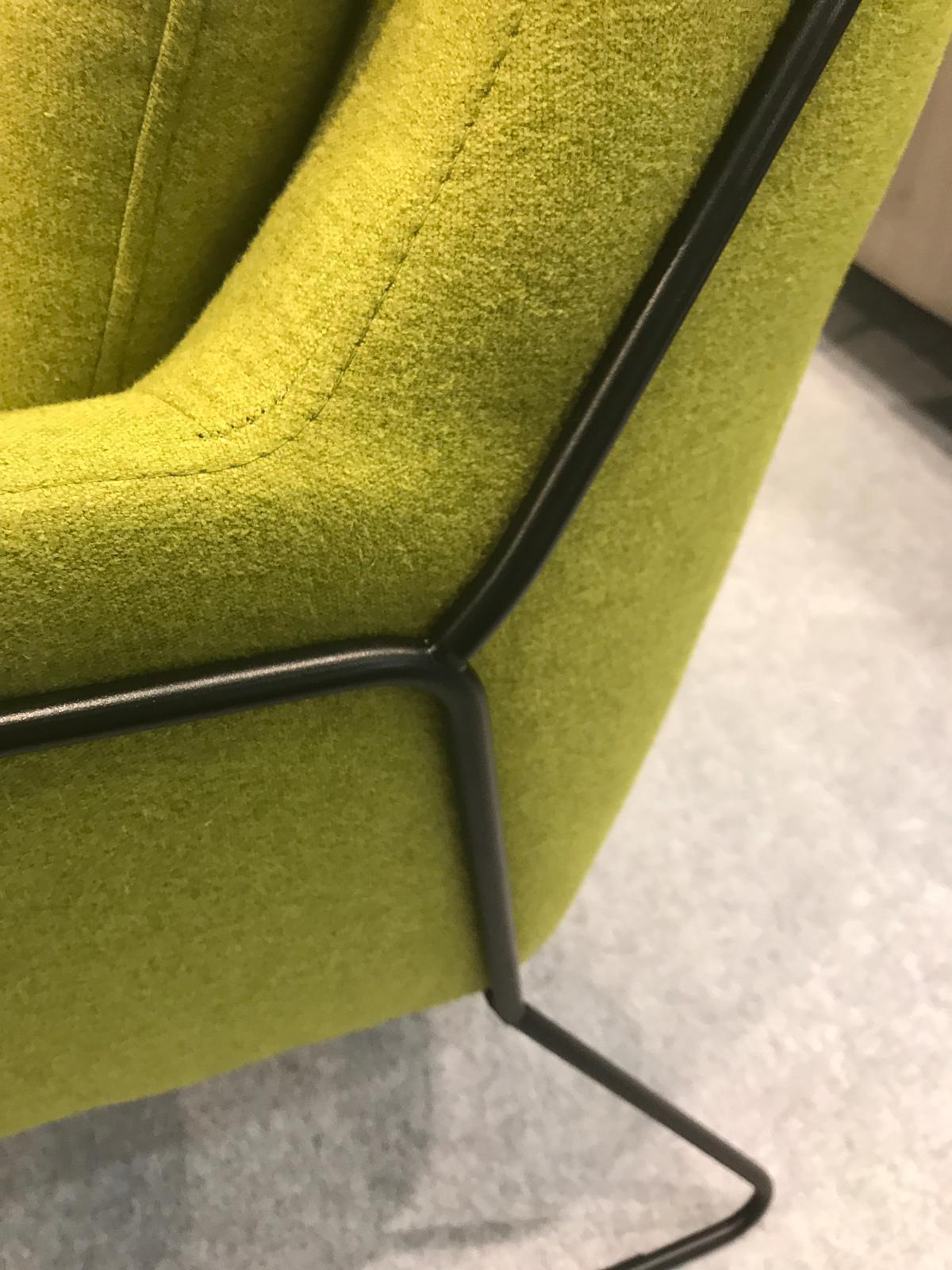 IMM-Cologne-black-exo-frame-on-green-upholstery.JPG#asset:180296