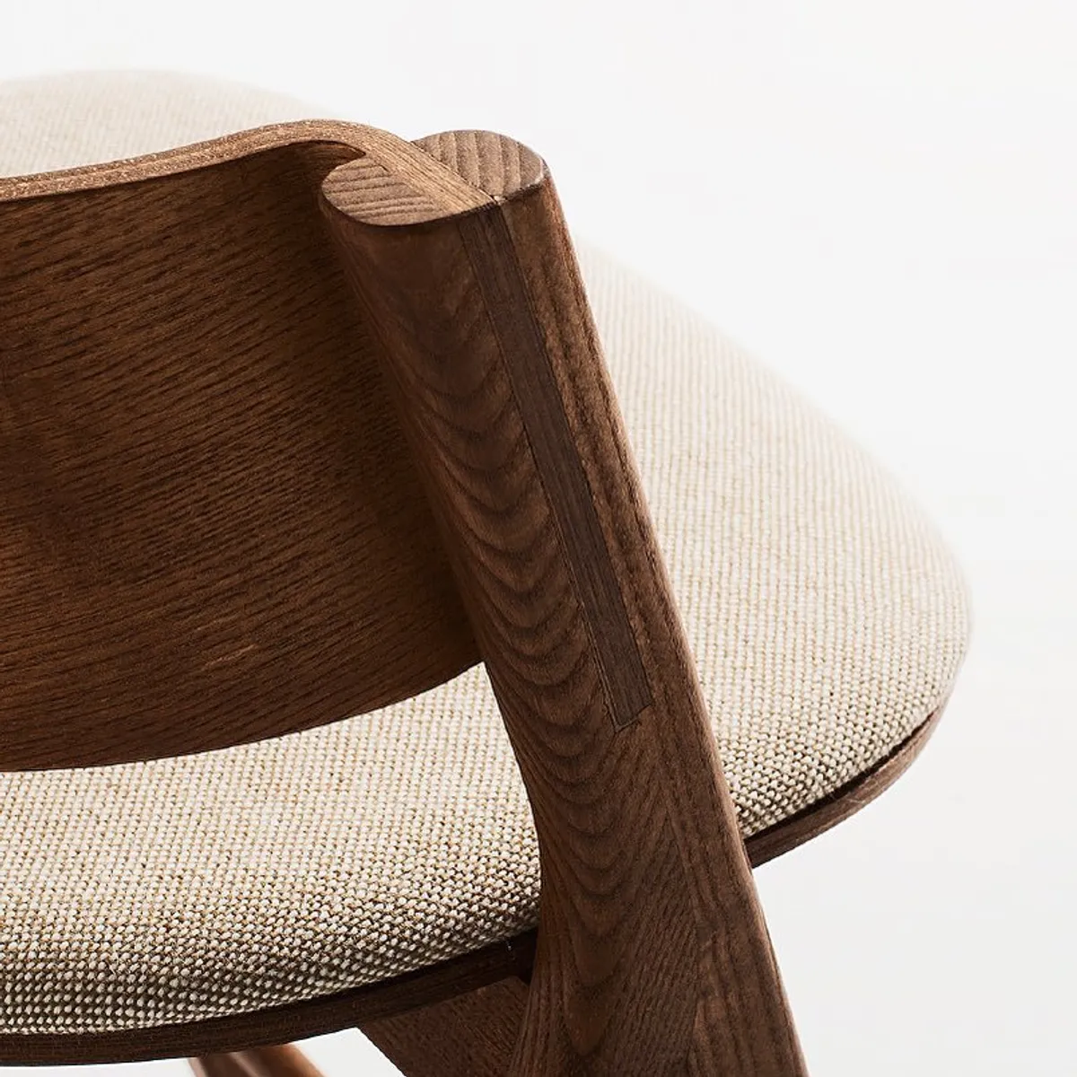 wood grain and upholstery Folly chair close up