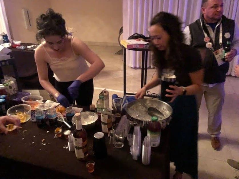Emily and Kimberly making their cocktail