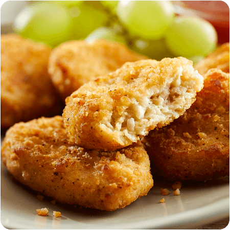 Close-up of golden brown plant-based nuggets.
