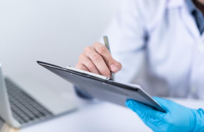 Clinician Holding Tablet