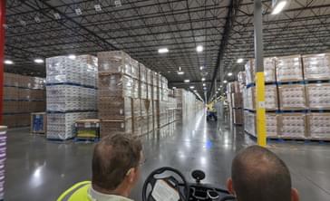 Touring a warehouse on a golf cart