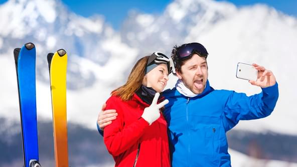 Young couple skiing outside in sunny winter mountains SBI 305167611
