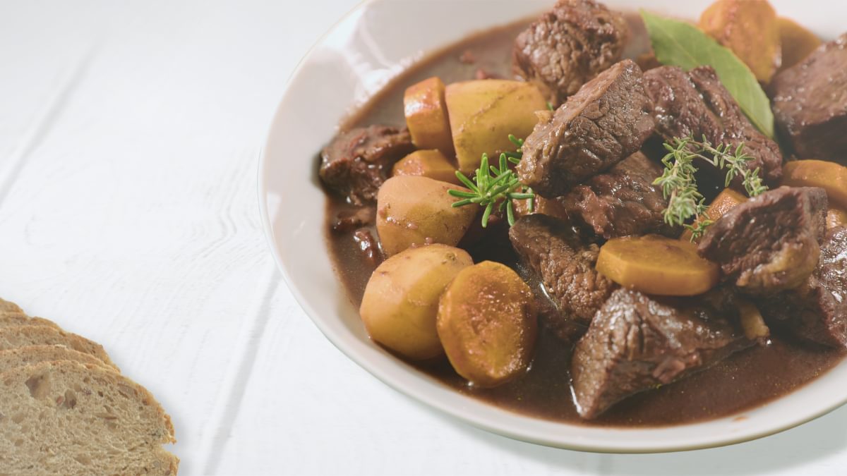 Juicy wild boar goulash, without garnish, with Christmas ingredients.