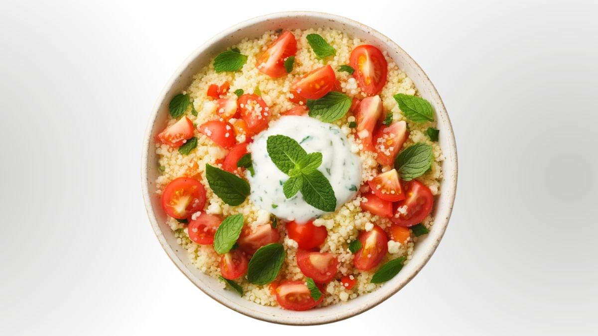 Couscous salad with tomatoes, mint, and coconut yoghurt