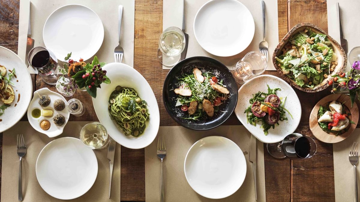 Diverse platters with food and empty plates