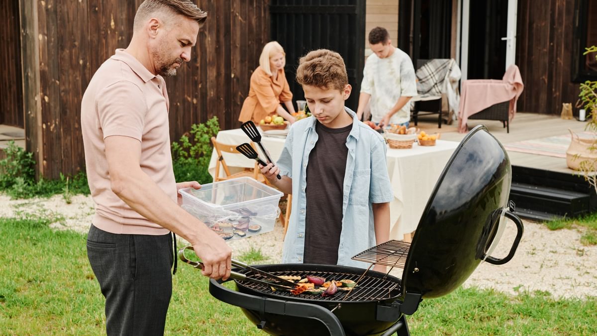 Father and son barbecuing