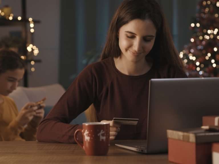 Girl ordering catering online on a laptop