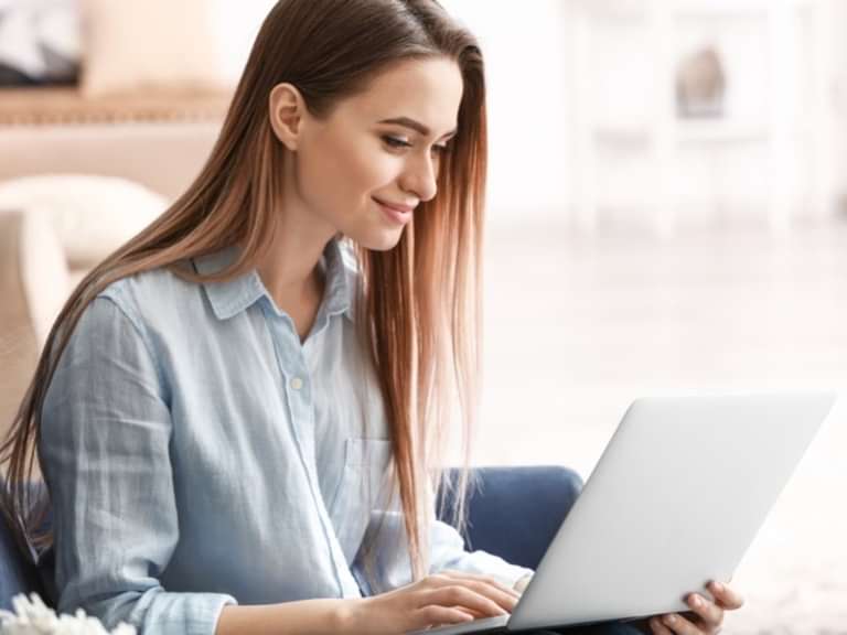 A girl typing on her laptop