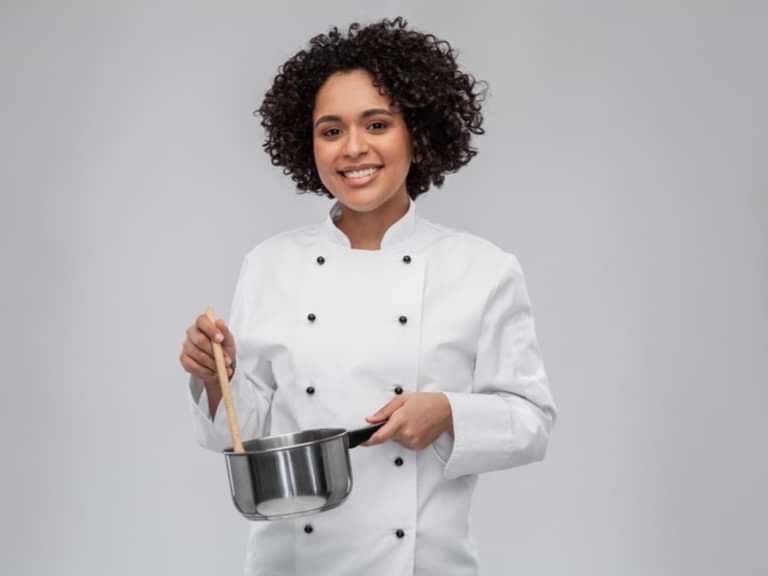 A female cook holding a bow