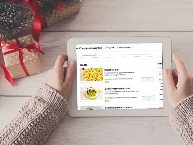 A woman holding a tablet with mymy menu on it